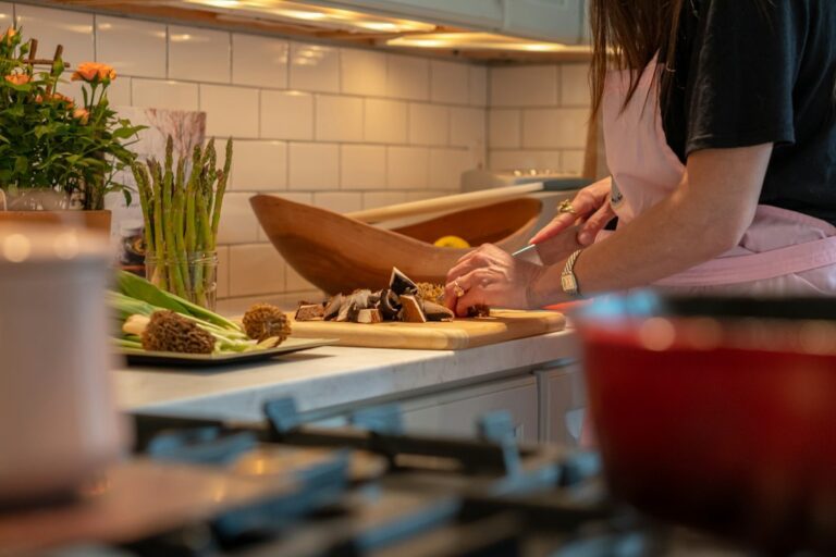 A home cook preparing vegetables in a kitchen